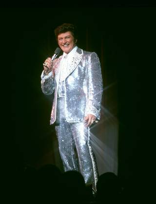 Liberace in one of his glittering costumes.