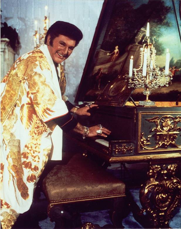 Liberace playing his blue-and-gold Steinway.