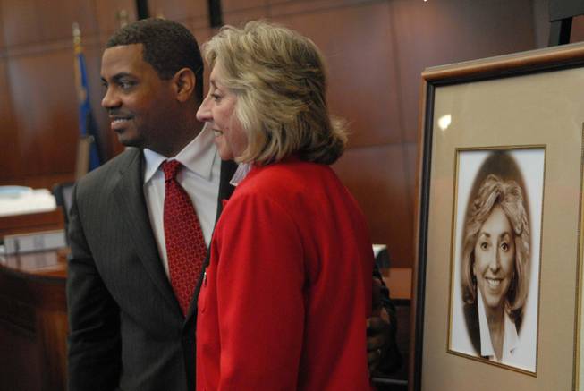 Nevada Senate Majority Leader Steven Horsford, D-Las Vegas, and U.S. Rep. Dina Titus, D-Nev., pose for photos Tuesday after Titus was inducted into the Nevada Legislature's Hall of Fame. The former state senator, when asked Wednesday about Gov. Jim Gibbons' no-show at her address to the Legislature, said she didn't expect him to attend. "He's probably busy trying to find something to do with all those Easter eggs he has left over," she said. 