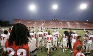 Players watch the action on the field as UNLV played its annual spring game at Sam Boyd Stadium in April. 