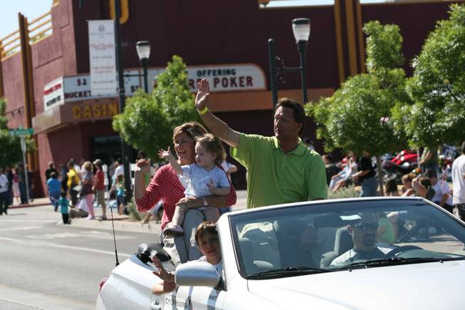 Henderson Mayoral candidate Steve Kirk, right, with his wife Amy and granddaughter Annie ride in a vehicle during Henderson's annual Heritage Parade on Water Street.
