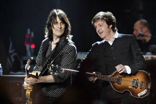 Rusty Anderson and Paul McCartney, shown early in the show.