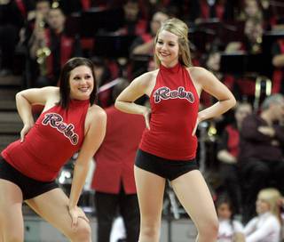 Rebel Girl Lindsay Bennett, right, dances with her team during a UNLV men's basketball game at the  Thomas & Mack Center in Las Vegas, Saturday, Feb. 14, 2009. 