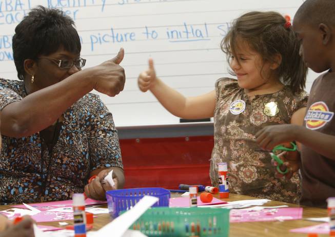 Perla Kehrt gets a thumbs-up from teacher Lori Jenkins in the after-school tutoring program at Rundle Elementary School. 