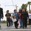 Peggy Tejido and her mother, Rosalinda Garcia, center, hold hands Monday while crossing the intersection of Wigwam Avenue and Las Vegas Boulevard with friends and Clark County Commissioner Steve Sisolak, left, for the first time using the newly installed stoplight. Tejido's 19-year-old daughter, Verlaine May Powless, was struck and killed by a vehicle and killed July, 25, 2008, while crossing the intersection.