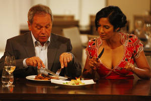 Chef Wolfgang Puck and judge Padma Lakshmi sample food on the first episode of <em>Top Chef: Las Vegas</em>