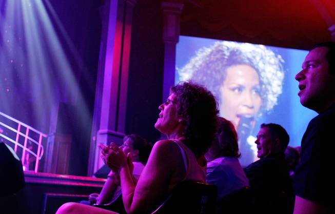 The audience reacts to singer Jazmine portraying Whitney Houston as ...