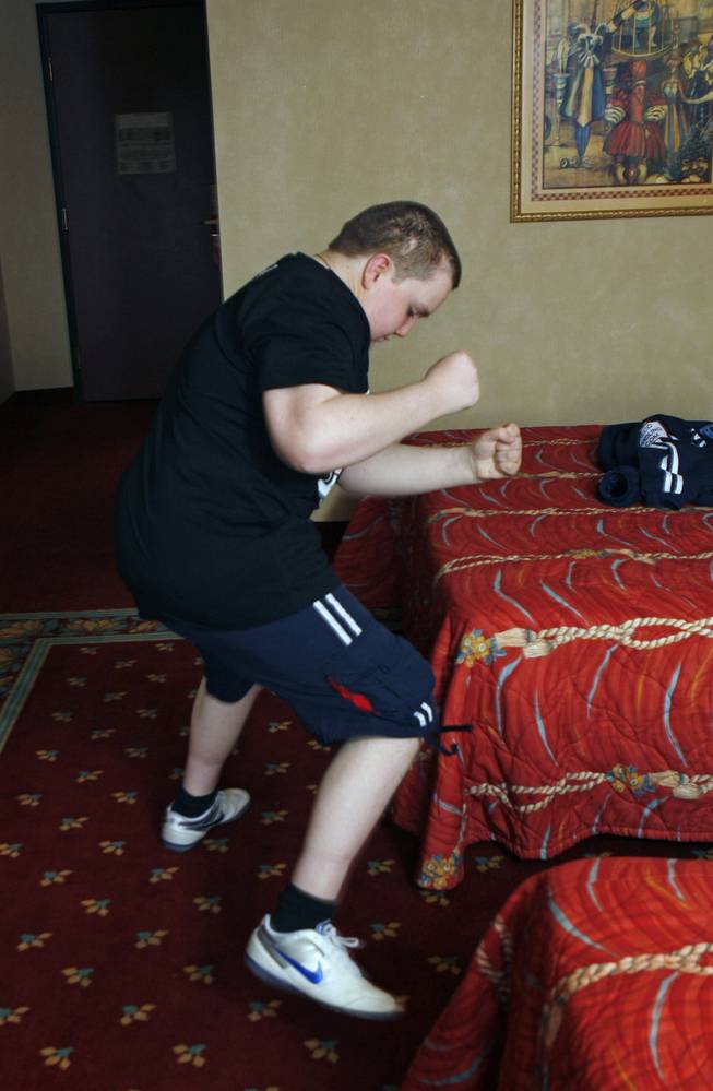 James Bowes, 20, a friend of Ricky Hatton from England, shows off his ring dance during an interview at his hotel room in Las Vegas Thursday, April 30, 2008. Bowes, who was born with hydrocephalus, water on the brain, is making his first trip to the United States this week to watch his favorite fighter.