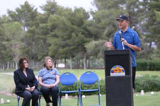 North Las Vegas Mayor Michael Montandon, right, speaks during the Friday groundbreaking ceremony for Craig Ranch Regional Park.  Councilwomen Shari Buck, center, and Stephanie Smith listen as the mayor speaks.