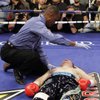 Referee Kenny Bayless checks on British boxer Ricky Hatton after he was knocked out by Manny Pacquiao, of the Philippines, in the second round of their junior welterweight title boxing match Saturday, May 2, 2009, at the MGM Grand in Las Vegas.