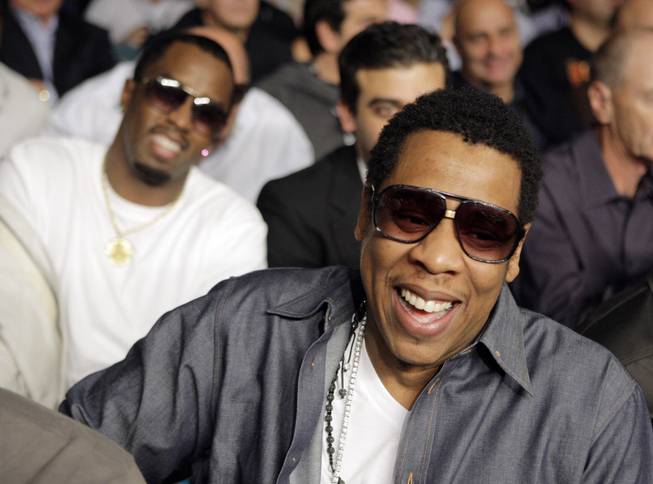 Music producer Jay-Z, right, sits in front of Sean "Diddy" Combs before the junior welterweight title boxing match between British boxer Ricky Hatton and Manny Pacquiao, of the Philippines, Saturday, May 2, 2009, at the MGM Grand in Las Vegas.