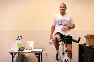 Director of the Silverman Triathalon, Frank Lowery, leads a spin class at the Henderson Multigenerational Center on Wednesday, May 6, 2009. 