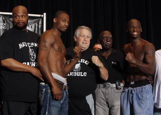 From left: Trainer Eddie Mustafa Muhammad ,IBF light heavyweight champion Chad Dawson boxing promoter Gary Shaw, trainer Jimmy Williams, and former champion Antonio Tarver pose during an official weighin at the Hard Rock hotel-casino Friday, May 8, 2009. Dawson will attempt to retain the title that he took from Tarver when the boxers meet for a rematch at the Hard Rock on Saturday.