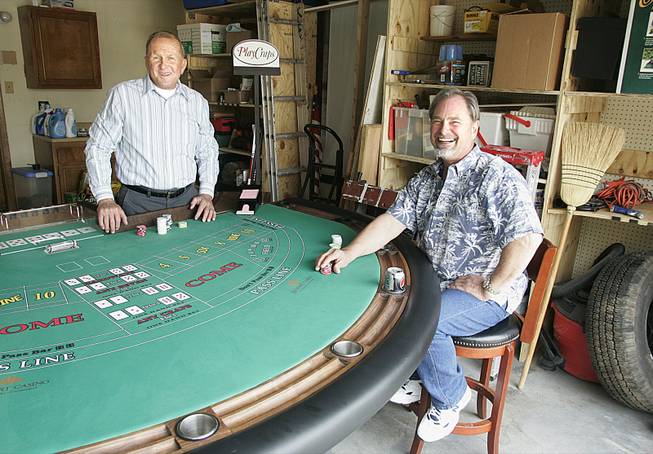 Michael Christian, left, and Jack Chappell are the inventors of Play Craps, a version of craps played with cards instead of dice. A big part of developing the game was designing the special table.