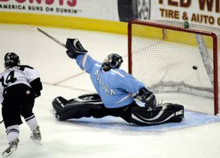 Las Vegas Wranglers forward Tyler Mosienko scores the only Las Vegas goal of the night against Alaska goaltender J.P. Lamoureux during game 3 of the National Conference finals at the Orleans Arena on Tuesday night.