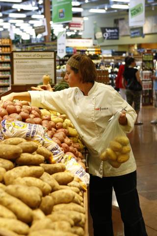 Laurine picks out potatoes on Top Chef: Las Vegas.