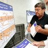 
Carl Hagelman, right, Station Casinos' senior director of design, and Layne Brandhagen, a consultant to Station Casinos, look at maps of Interstate 15 on Wednesday at Clark High School during a public hearing on the I-15 Resort Corridor Study.