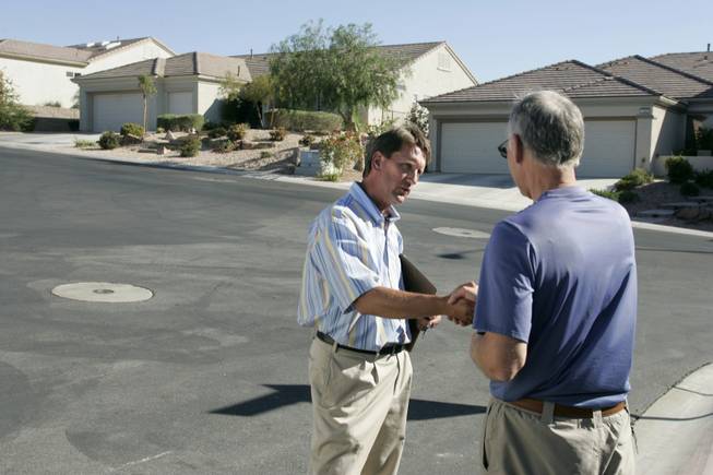 Henderson City Councilman and mayoral candidate Steve Kirk speaks to resident Bob Tank in an Anthem neighborhood. Kirk, a Republican, says he will never vote to increase taxes and that he opposed taxes that built the Las Vegas Beltway.