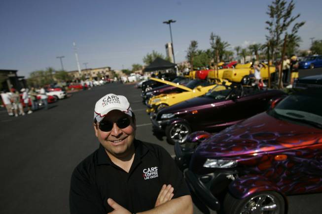 Salomon Braun, founder of the Cars and Coffee car show, pauses at the event Saturday.