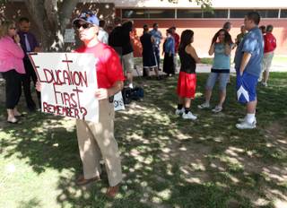 Students, teachers and PTA members gather Thursday in front of Valley High School to protest Gov. Jim Gibbons' veto of the tax package. 