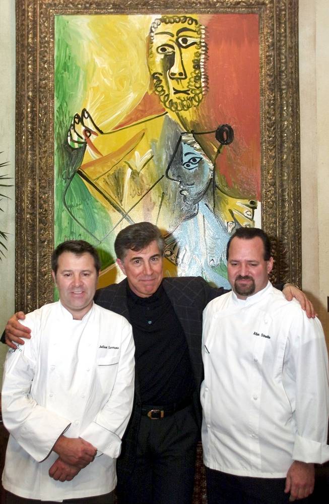 Julian Serrano, left, chef of the Picasso restaurant (Bellagio hotel-casino), Mirage Resorts Chairman Steve Wynn, and Alessandro Stratta, chef of the Renoir restaurant (Mirage hotel-casino), pose in front of Pablo Picasso's "Fugures II" at Picasso restaurant Monday January 10, 2000. Both the Picasso and the Renoir restaurants were selected as 5-star restaurants by the 2000 Mobile Travel Guide.