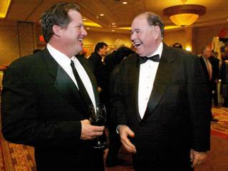 Ed Herbst, left, of the Terrible Herbst Oil Company, shares a laugh with Michael Gaughan, chairman of Coast Resorts, during a Temple Beth Shalom reception at the Suncoast Sunday, January 11, 2004. Gaughan was honored as the Temple Beth Shalom Man of the Year.