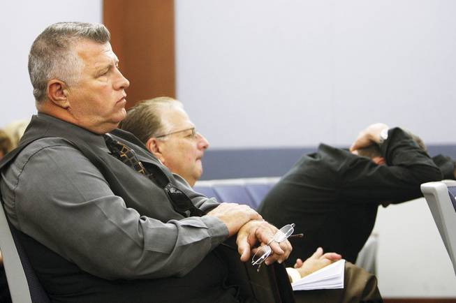 Gilbert, from left, attends Friday's hearing with Mark Alden and John Cummings, a CSN English professor. No ruling was made on the defense bid to have charges against Gilbert tossed; the hearing is set to continue Monday.