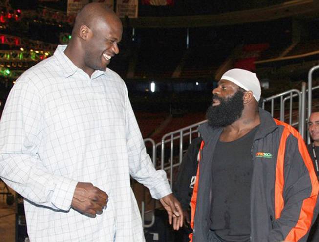 In this image released by CBS, NBA star Shaquille O'Neal, left, poses with mixed martial arts heavyweight sensation Kimbo Slice at the official CBS EliteXC Saturday Night Fights weigh-in at the Prudential Center in Newark, N.J. on May 30, 2008.