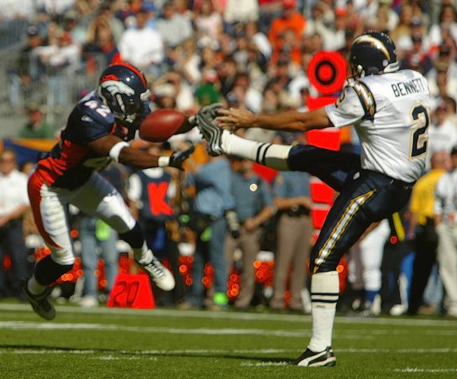 Denver Broncos safety Sam Brandon (42) blocks a punt by San Diego punter Darren Bennett in the endzone during the second quarter in Denver on Sunday, Oct. 6, 2002. The Broncos scored on a safety on the play.