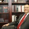 Invested in the community: UNLV's Boyd Law School Dean John V. White is shown in his office June 3. 