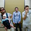 In this film publicity image released by Warner Bros., Zach Galifianakis, left, Bradley Cooper, center, and Ed Helms are shown in a scene from "The Hangover."