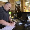 General Manager Roger Shoaff checks room availabilities on June 22 at the renovated Boulder Dam Hotel.