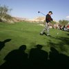 Spectators look on during an annual Three-Tour Challenge at the Reflection Bay Golf Club at Lake Las Vegas in Henderson in 2004. The golf course at Lake Las Vegas is scheduled to close June 30 and its employees will be laid off.