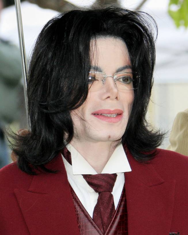Michael Jackson arrives at the Santa Barbara County courthouse in this April 27, 2005, file photo in Santa Maria, Calif.