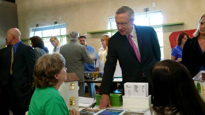 Senate Majority Leader Harry Reid (D-Nev.) makes the rounds at an energy conservation fair following the Blue Ribbon Panel Tuesday at Springs Preserve.