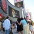 Fans watch the televised Michael Jackson memorial tribute on the video screens at Planet Hollywood.