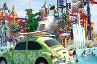 A Volkswagen Beetle squirts water out in the foreground of the overview image of a Utah Cowabunga water park. (Courtesy Photos)