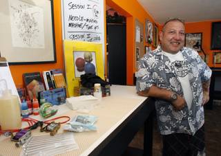 Brian Perkins, owner of L.V. Ink, poses in the tattoo lab during the opening of the tattoo school on 1501 Las Vegas Blvd. Thursday, July 9, 2009.  

