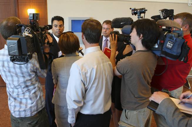 Prosecutors Ravi Bawa and David Schubert, right, speak to the media July 13, 2009, after jurors returned a guilty verdict on 51 of 52 felony charges in the trial of Steven Zegrean. Zegrean stood trial in connection with a July 2007 shooting at the New York-New York casino.