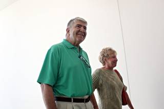 The first patient, Randy Capurro, left, and his wife, Netty, are welcomed to the Cleveland Clinic Lou Ruvo Center for Brain Health, in Las Vegas on Monday morning, July 13, 2009. 