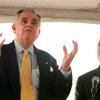 Sen. Harry Reid, right, listens as Transportation Secretary Ray LaHood speaks July 2 at a news conference to designate a high-speed-rail corridor.