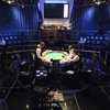 Dealers and production crews prepare for the 7th day of competition at the ESPN feature table July 14 at the World Series of Poker Main Event at the Rio. Crews pull 15 hours, operating as many as 40 cameras to pull off the broadcast.
