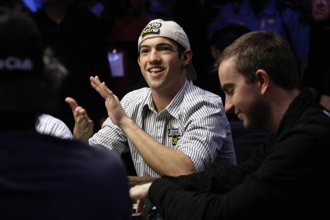 Joseph Cada claps after finishing in the final nine of the World Series of Poker at the Rio Hotel and Casino in Las Vegas on Wednesday, July 15, 2009. Cada will play in the final table in November in Las Vegas.