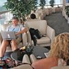Lounging around: Michael Marks of Cleveland works with his wife, Debbie, in the Continental Airlines' Presidents Club at McCarran International Airport on July 20. 