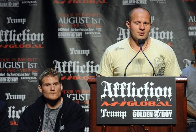 Mixed martial arts heavyweight fighters Josh Barnett (left) and Russia's Fedor Emelianenko appear in New York on June 3, 2009, during a press conference for Affliction's August event in Anaheim, Calif. The event and fighting promotion were canceled after Barnett tested positive for a banned substance.