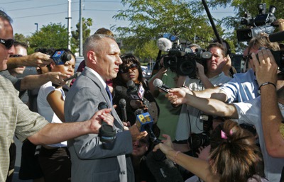 Los Angeles homicide detective Greg Strenk speaks to the media Tuesday outside the Las Vegas offices of Dr. Conrad Murray, Michael Jackson's personal doctor. Authorities entered the medical office as part of a manslaughter investigation into the Michael Jackson's death. 