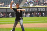 WEC bantamweight champion Miguel Torres throws out the first pitch at Thursday's historic Chicago White Sox game. Following Torres' lead, White Sox star Mark Buehrle threw an epic perfect game, leading Chicago past Tampa Bay 5-0.
