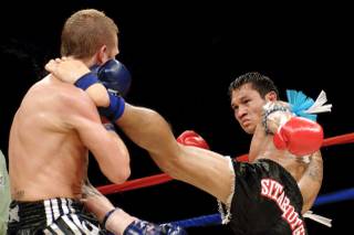 Malaipet throws a head kick against Richard Fenwick during World Championship Muay Thai inside the Las Vegas Hilton Showroom Saturday, July, 25 2009.
