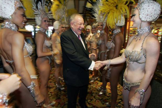 Las Vegas Mayor Oscar Goodman (that's him in the center) greets "Jubilee!" showgirls in the Golden Nugget before making his grand entrance to a party celebrating his 70th birthday at the Fremont Street Experience.