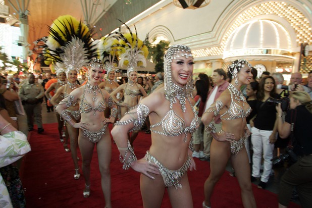 "Jubilee!" showgirls make up a procession as Las Vegas Mayor Oscar Goodman and his wife Carolyn walk to the stage.